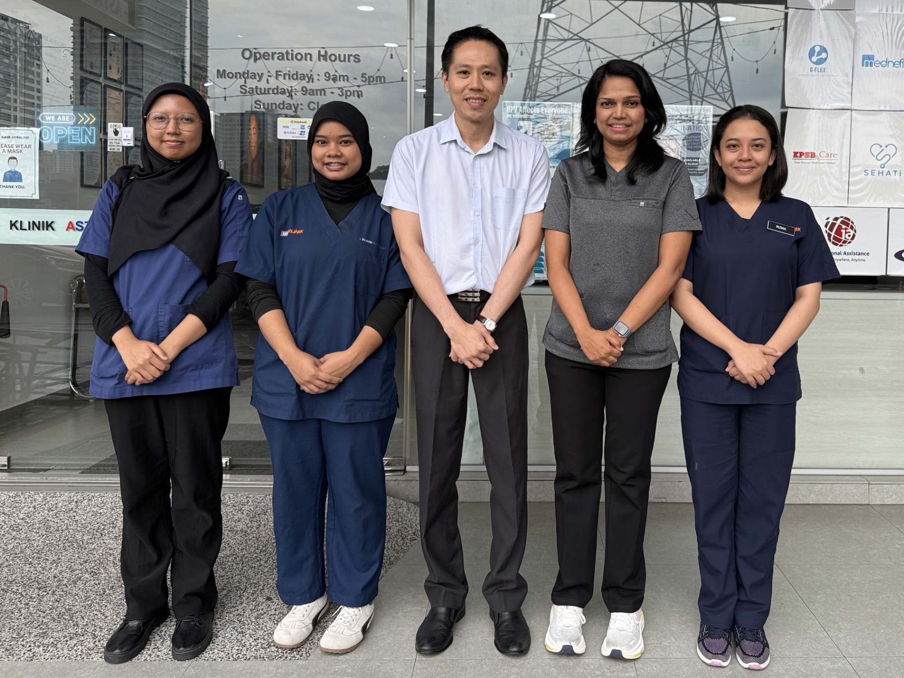 Klinik Astracare team standing in front of the clinic in Maluri, Kuala Lumpur